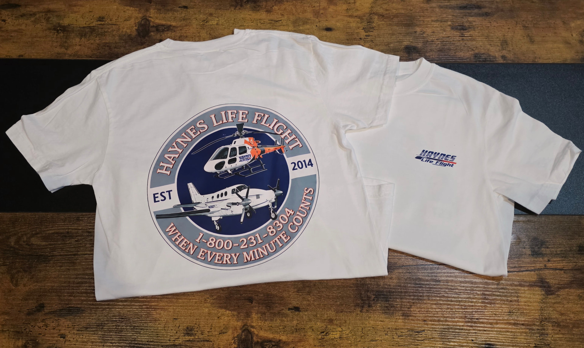 White t shirt with a full color Haynes Life Flight circle logo printed on the back