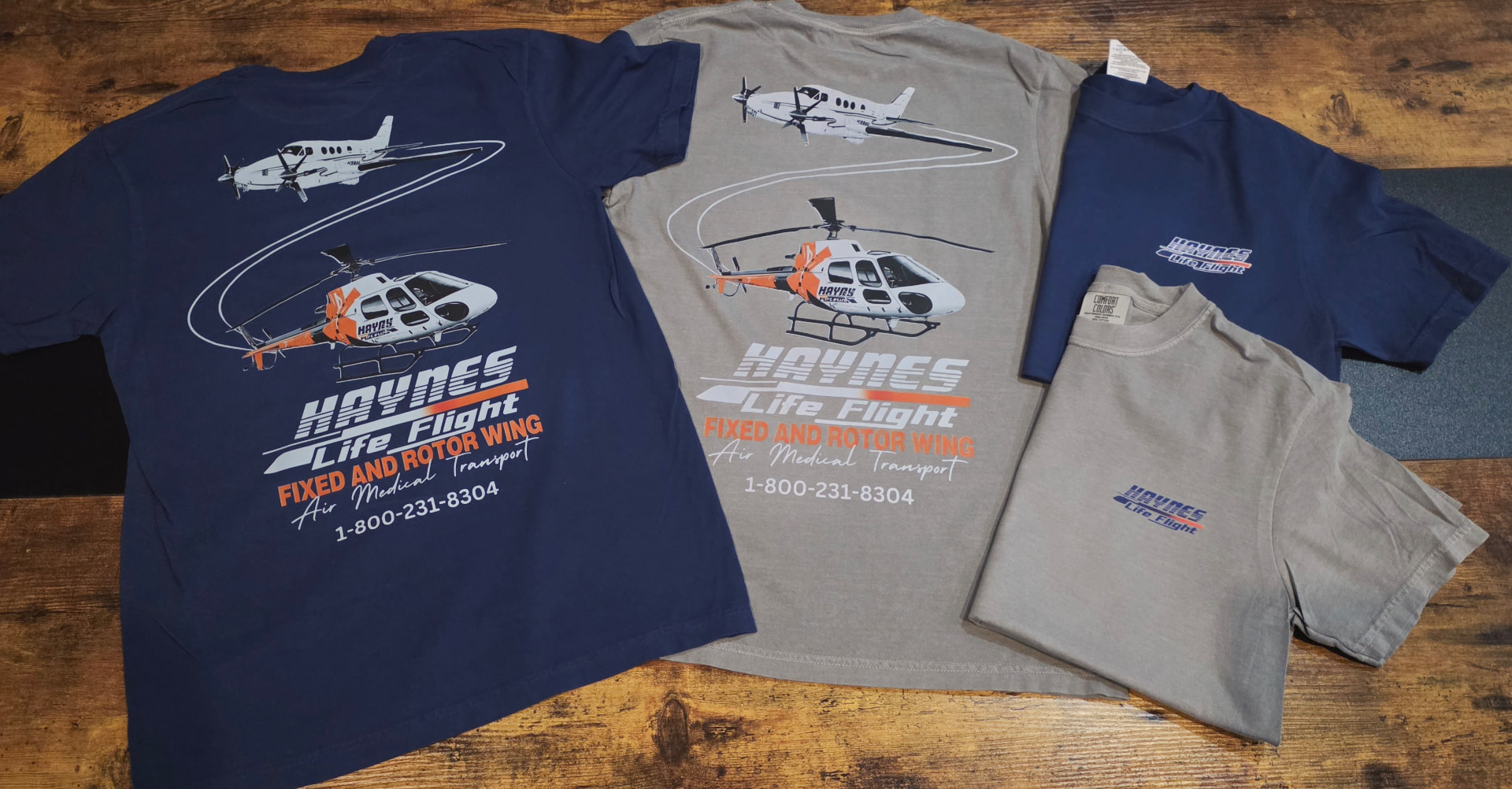 Navy and grey t shirts printed with Haynes Life Flight fixed and rotor wing artwork
